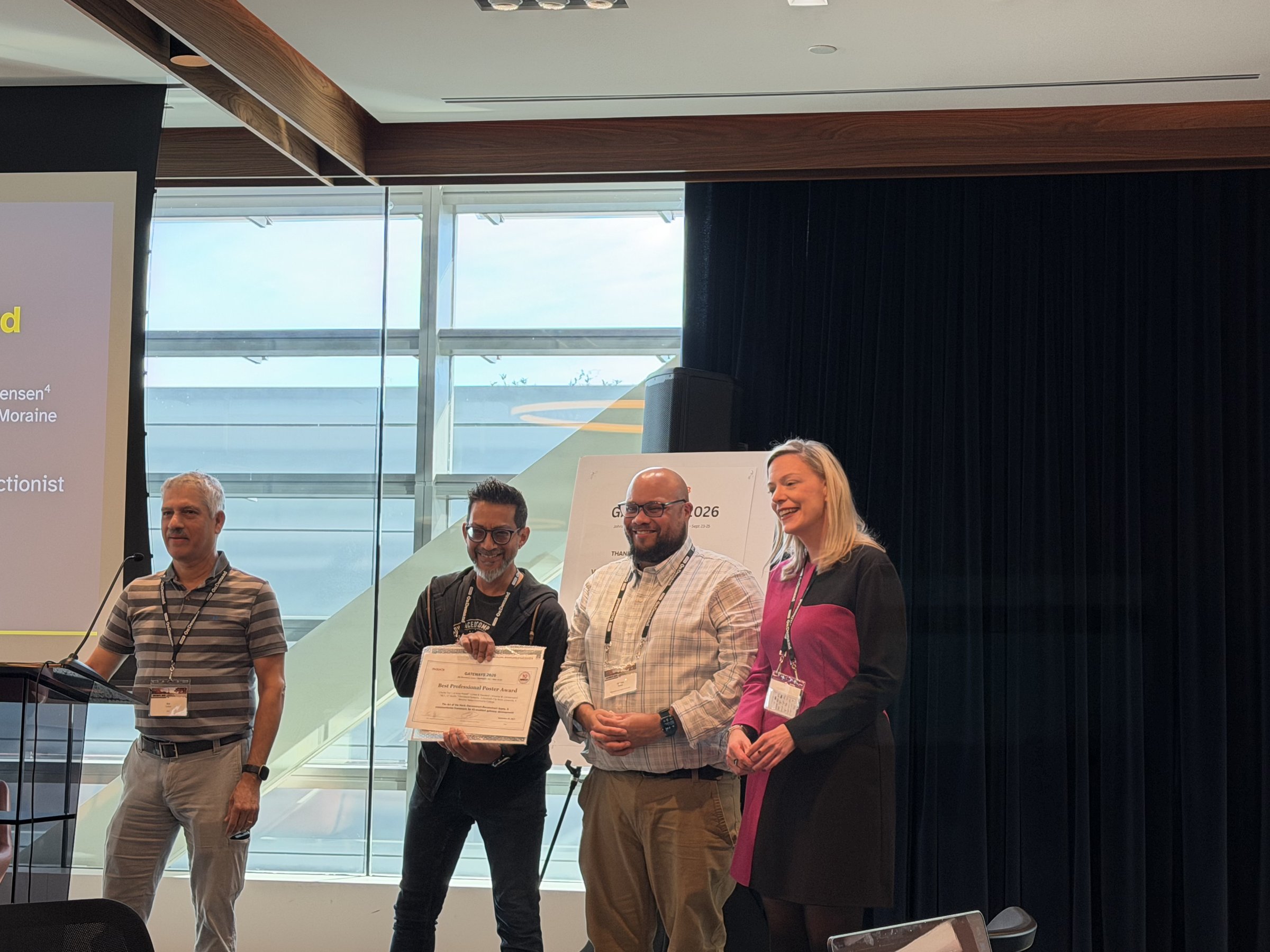 Charlie Dey, Je'aime Powell, and Dr. Kristine Christensen accepting the Best Professional Poster Award for the "Art of the Hack" poster at Gateways 2026