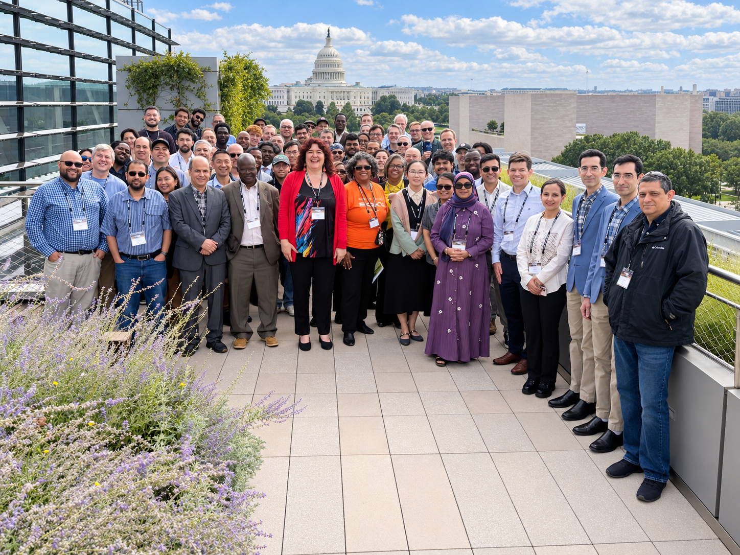 Gateways 2026 conference participants gathered for a group photo on a rooftop terrace, with the U.S. Capitol visible in the background